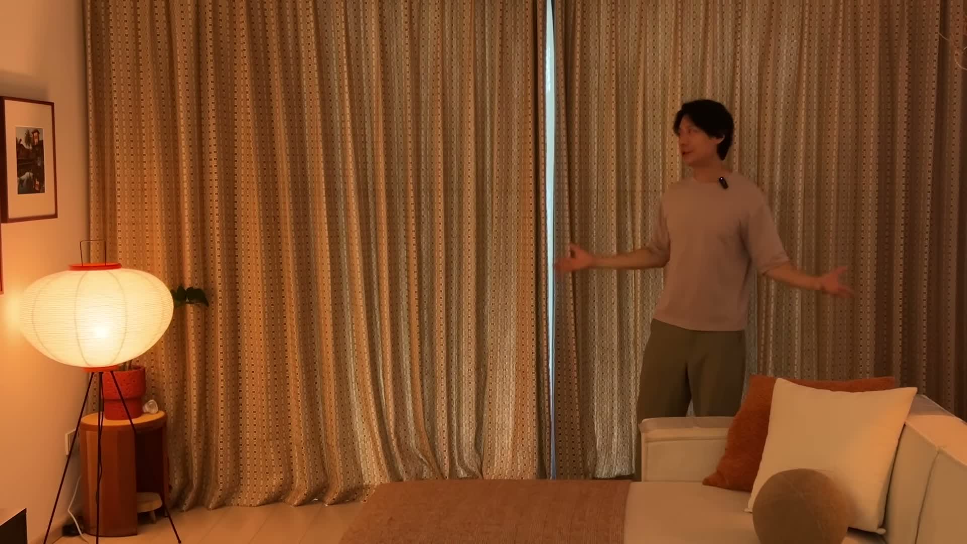 The full jacquard curtain wall in the living room, red paper lamp glowing beside it
